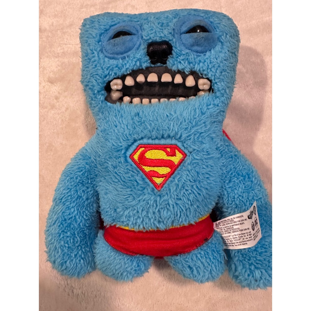 Fuggler x DC Comics Superman Plush Monster Blue Shaggy Funny Ugly Monster Zuru
